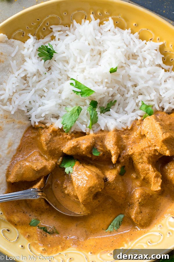 Instant Pot Chicken Tikka Masala served with fluffy white rice, ready to eat.