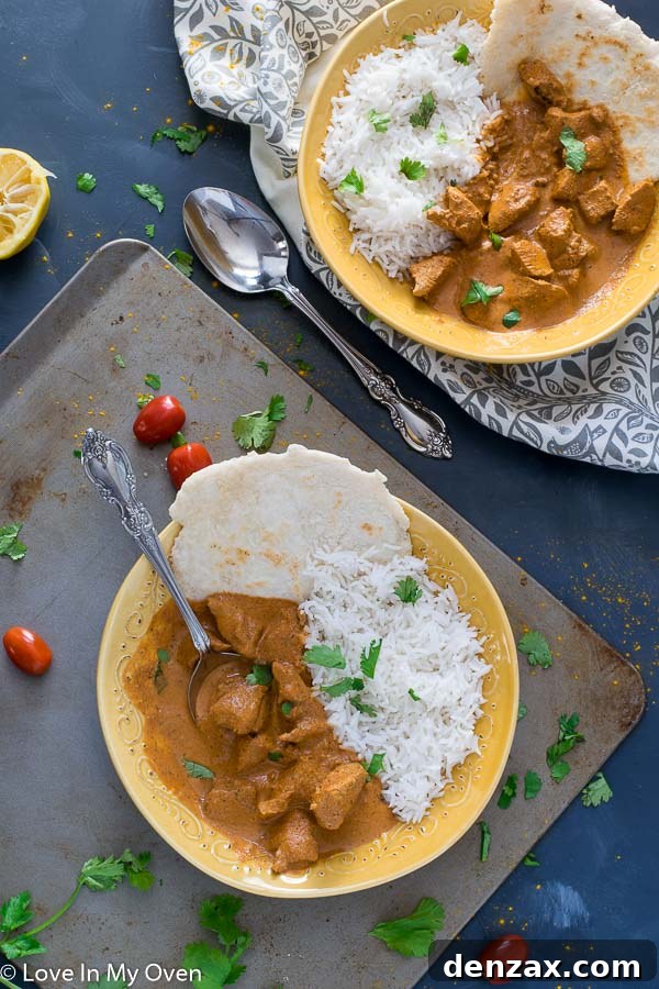 Delicious Chicken Tikka Masala, garnished with fresh herbs, ready to be served.