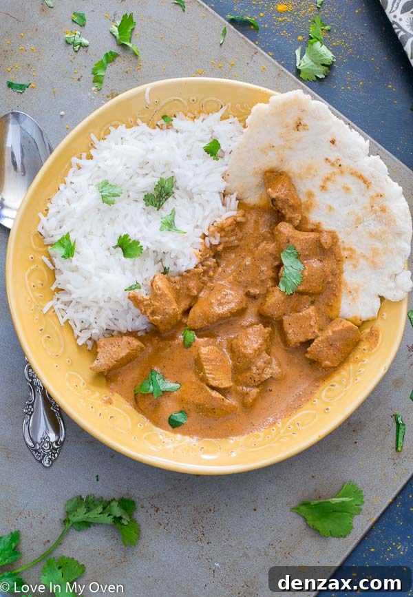 A bowl of rich and creamy chicken tikka masala, perfect for a cozy meal.