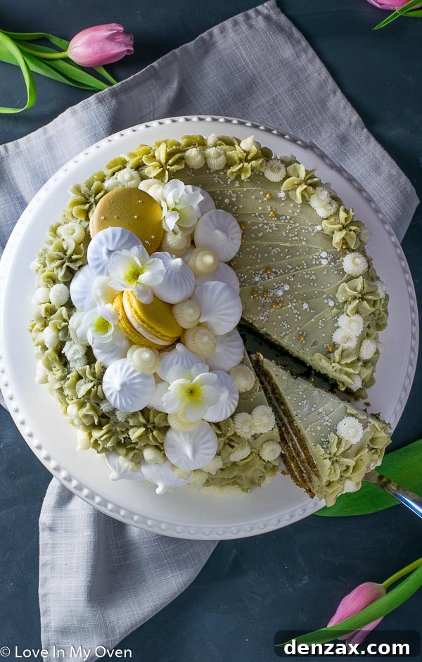 Close-up of a frosted Matcha Vanilla Cake, showcasing its vibrant color and smooth texture.