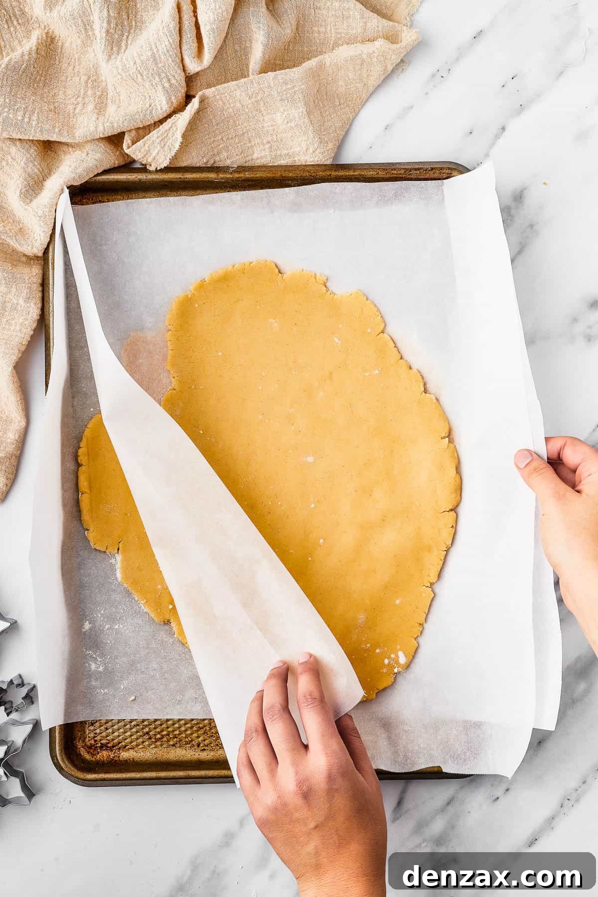 Rolled cookie dough on parchment.
