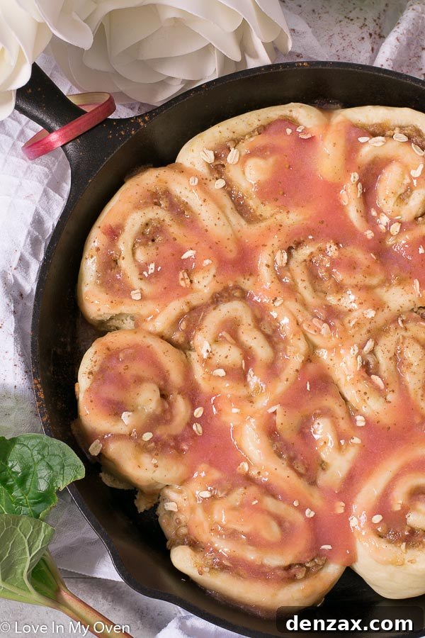 A warm pan of Rhubarb Streusel Rolls, fresh from the oven and glistening with glaze