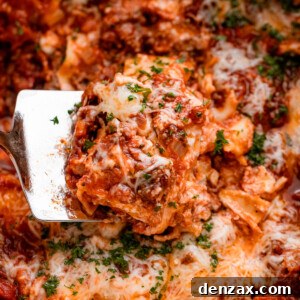up close shot of a spatula lifting up a piece of lasagna from the slow cooker.