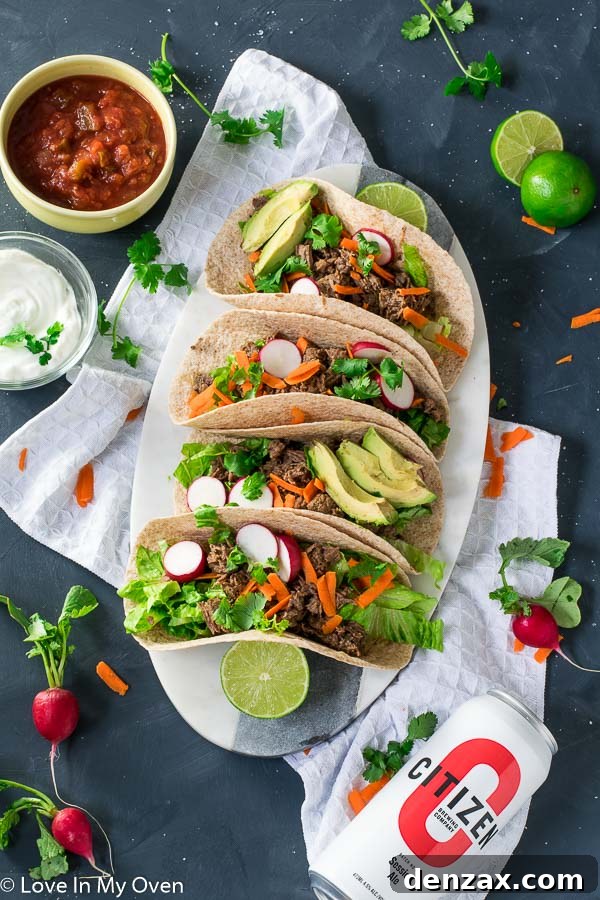 Delicious Instant Pot Beef Barbacoa Tacos served with fresh toppings