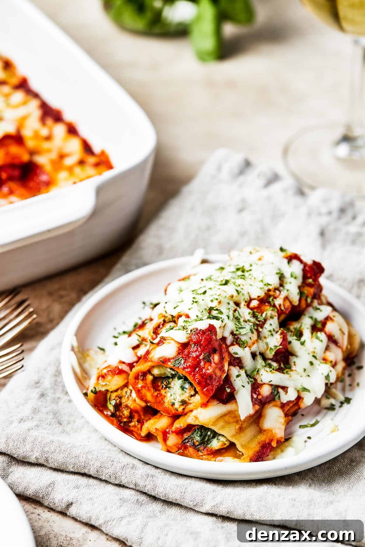 A warm, inviting serving of cheese pasta presented on a small, elegant white plate, ready to be savored.