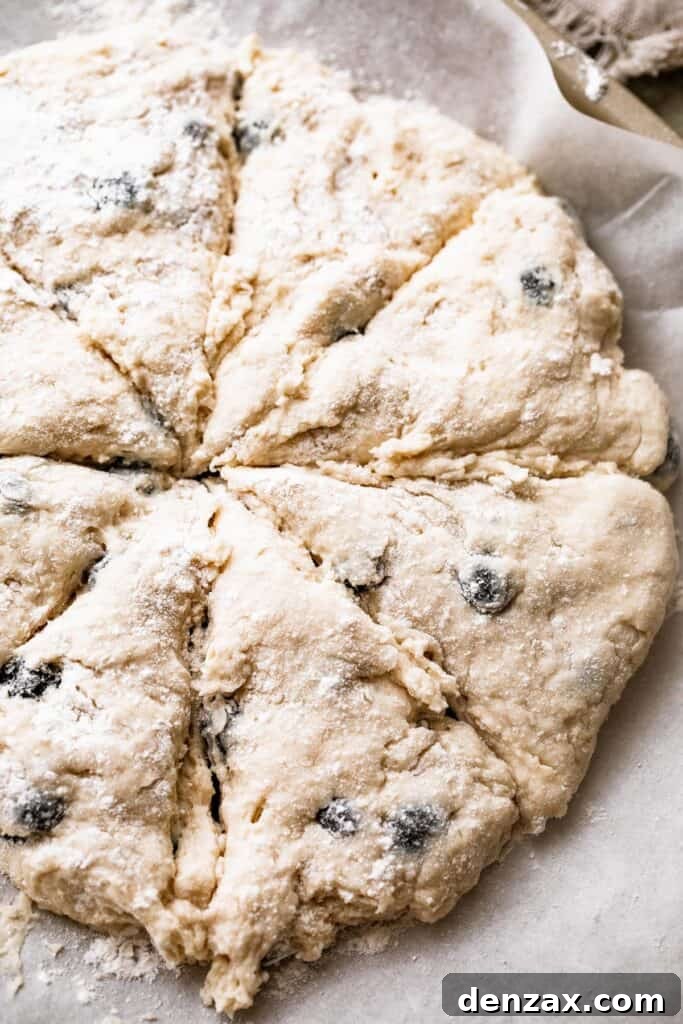 a round loaf of dough cut into eight slices