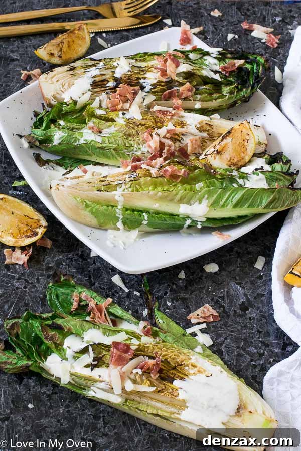Close-up of grilled romaine hearts, showing the beautiful char and vibrant green, ready for dressing.
