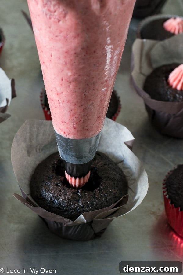 Toasted Marshmallow Strawberry Cupcakes 6 Filling a chocolate cupcake with strawberry buttercream