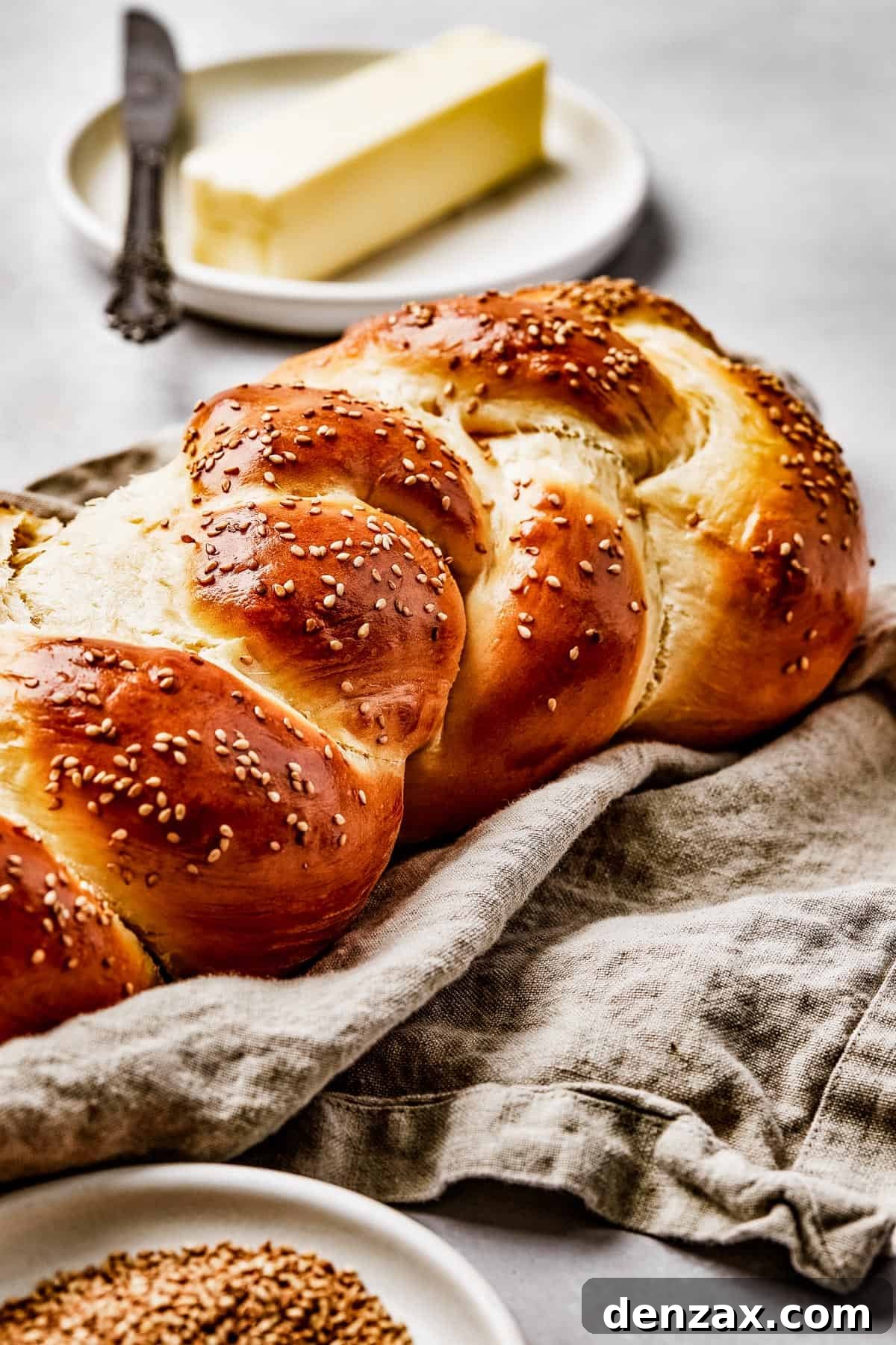 Close-up shot of a challah loaf, to show the texture of the braided sections.