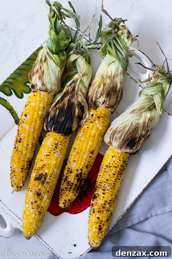 Freshly grilled corn on the cob, perfectly charred and ready for elote preparation