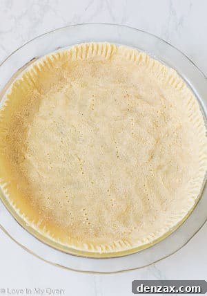 Pressing almond flour dough into pie plate