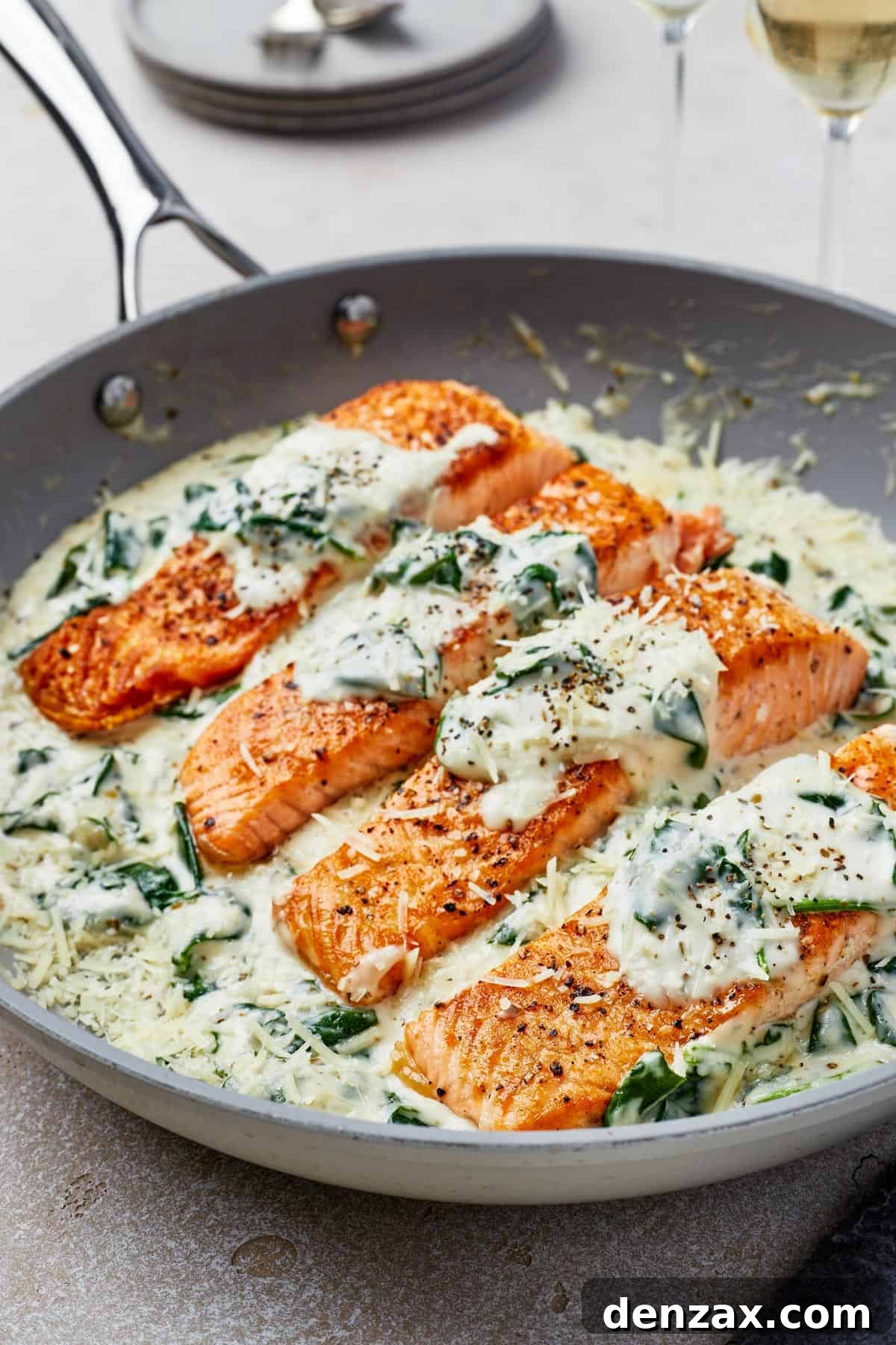 Creamy Florentine Salmon 3 Close-up shot of pan-fried salmon in Florentine sauce.