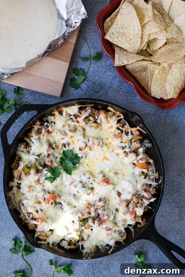 Queso Fundido with Chorizo, a delicious melted cheese dip perfect for parties