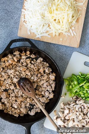Chorizo cooking in a cast iron skillet on the grill