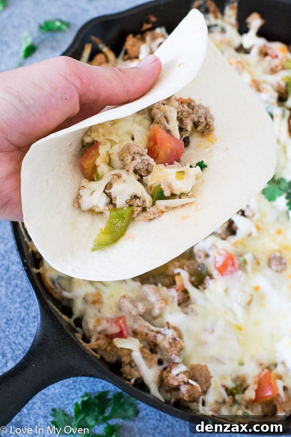 Serving Queso Fundido with Chorizo with warm tortillas and garnishes