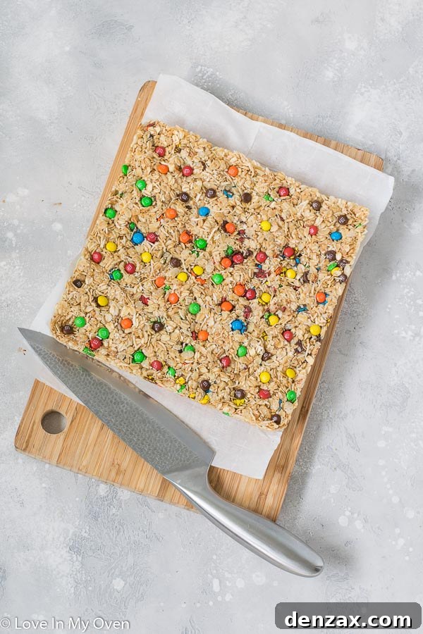Homemade M&M Granola Bars cut into squares, showcasing their festive appearance