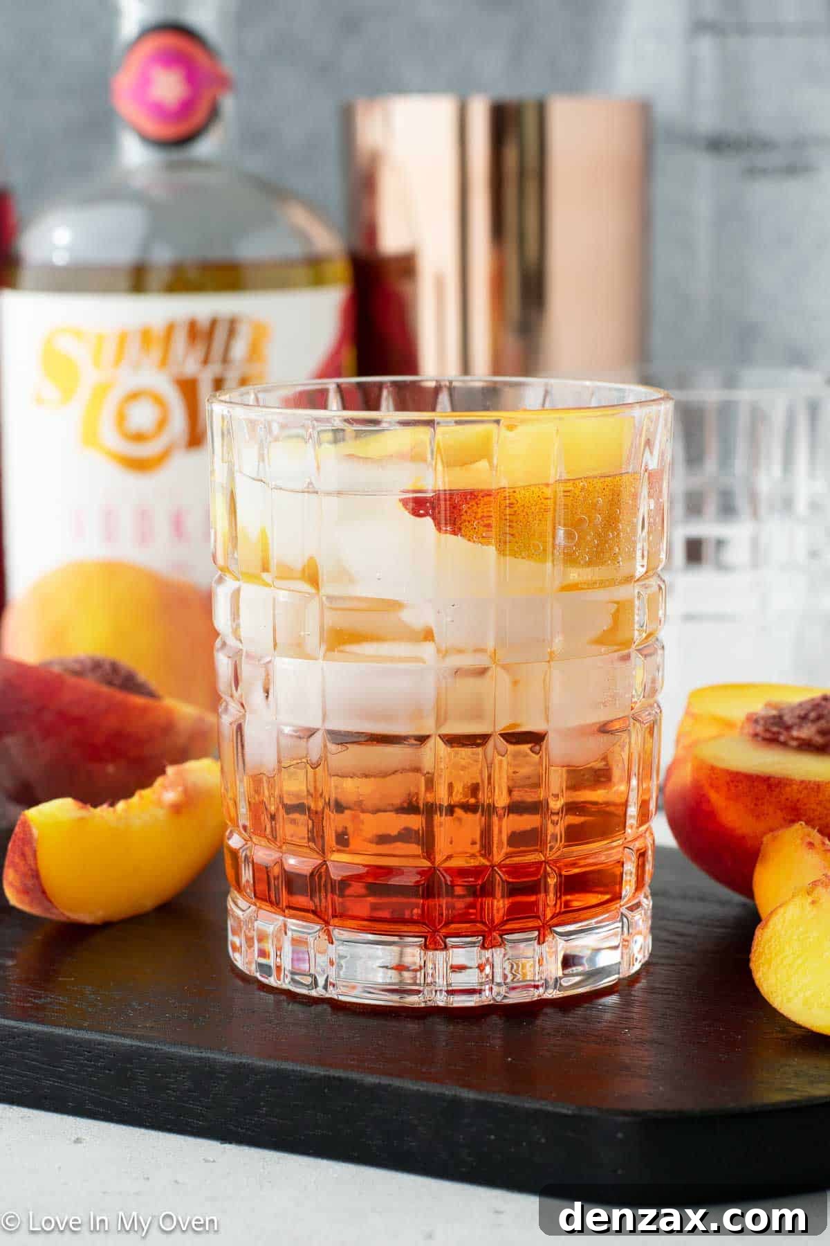 sparkling peach vodka cocktail with fresh peaches