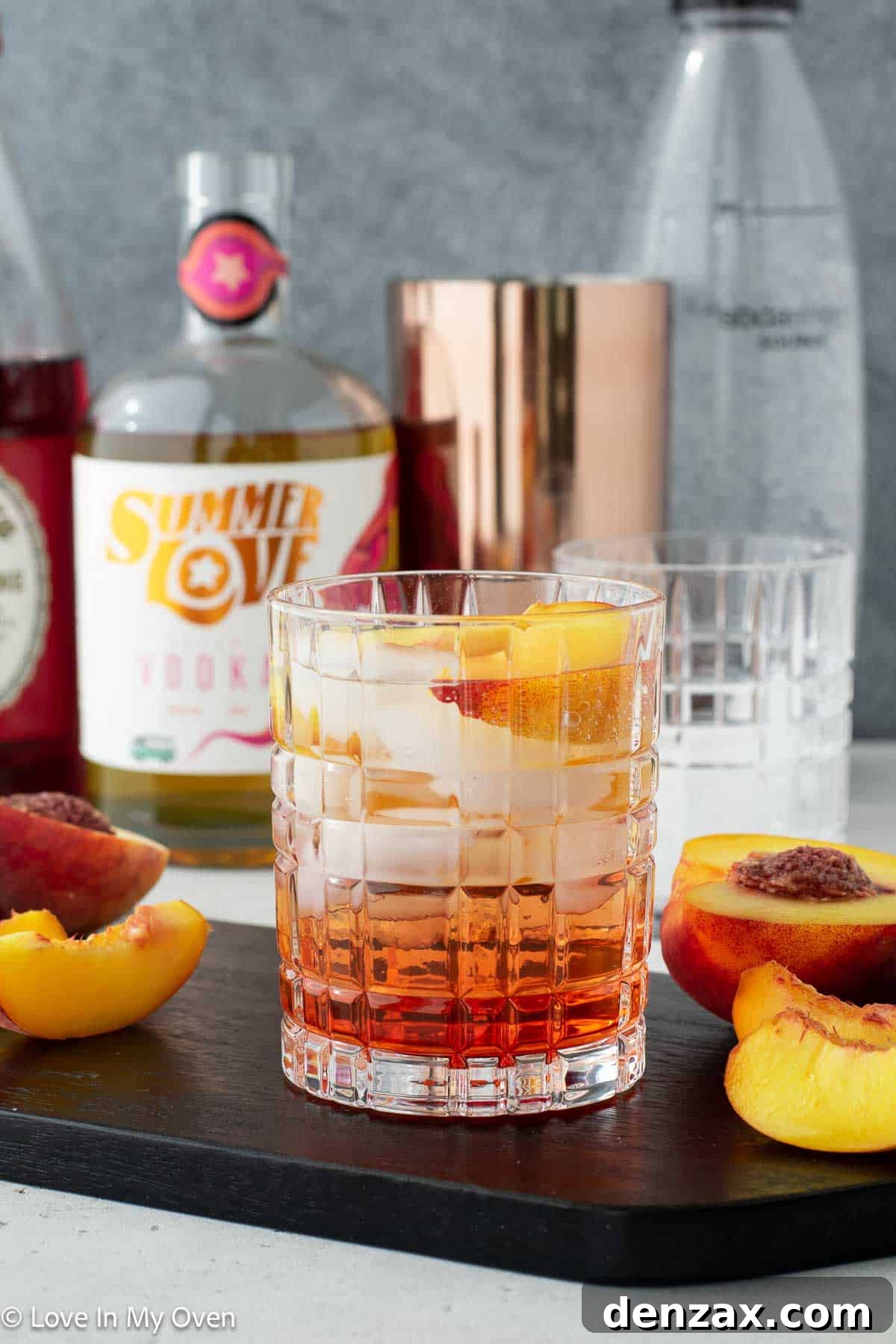 refreshing sparkling peach vodka cocktail with peach slices
