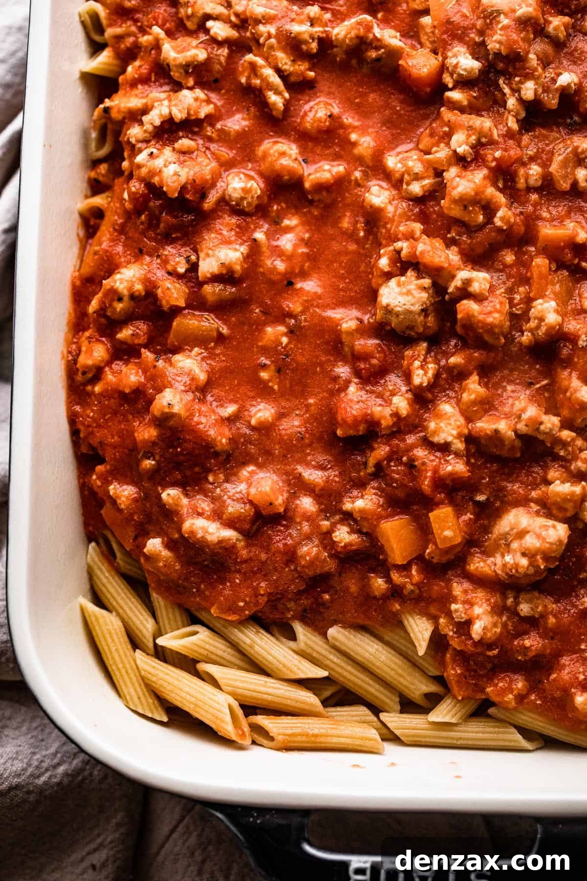 ground turkey tomato sauce poured over penne pasta.
