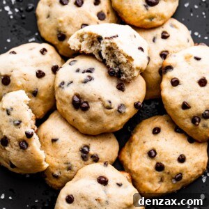 overhead shot of banana chocolate chips cookies served on a black plate.