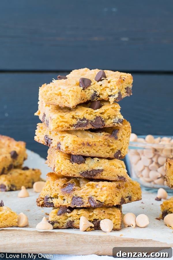 Deliciously moist and chewy butterscotch brownies with melted chocolate chips, freshly baked in a square pan.