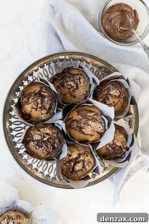 A stack of freshly baked Nutella muffins, showcasing their soft texture and delightful swirls.