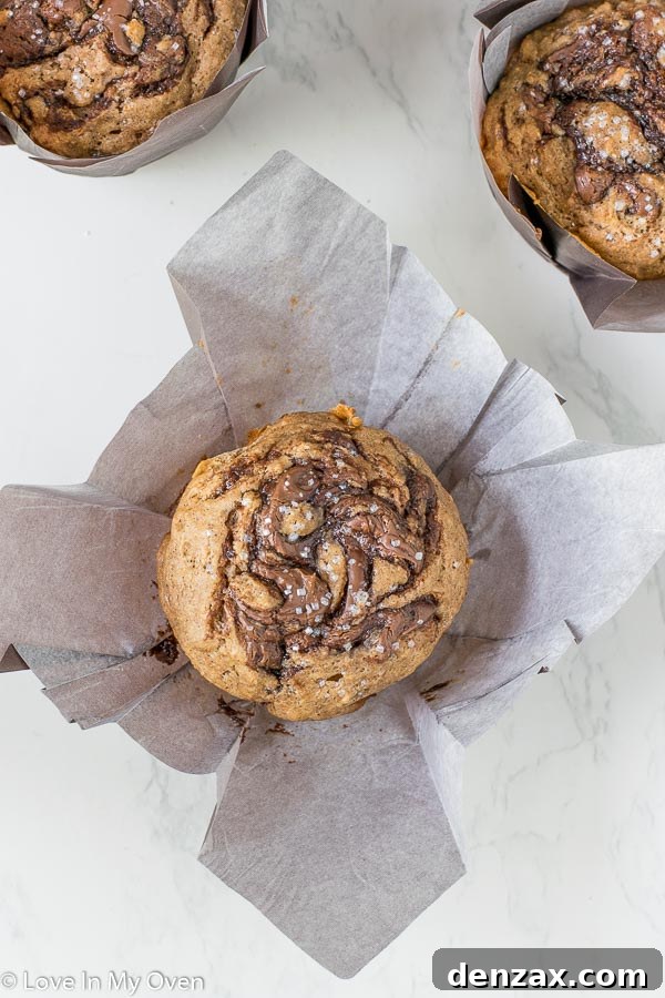 Close-up of a single Nutella muffin, showcasing its moist interior and swirls.