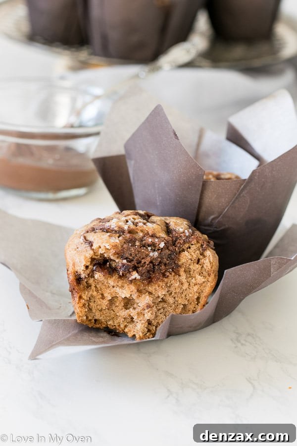 Delicious Nutella muffins cooling on a wire rack after baking.