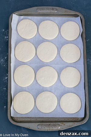 A close-up of another baked cream cheese cookie with a perfectly golden-brown edge.