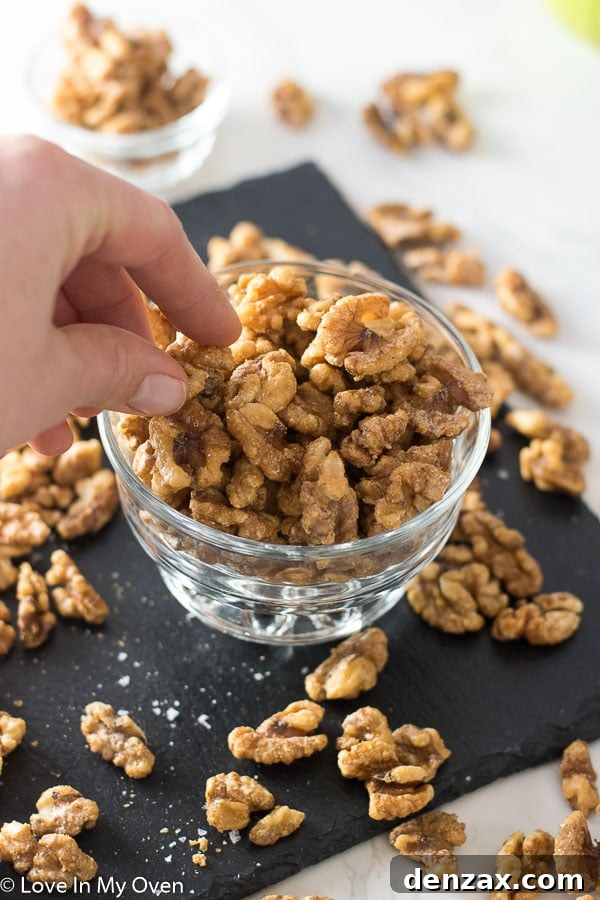 Close-up of healthy candied walnuts, showing their glossy coating.