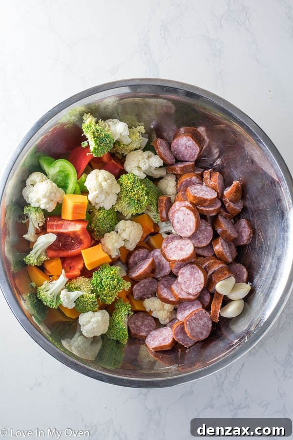 Sheet Pan Sausage and Roasted Vegetables 3 Variety of Roasted Vegetables and Sliced Sausage on a Sheet Pan
