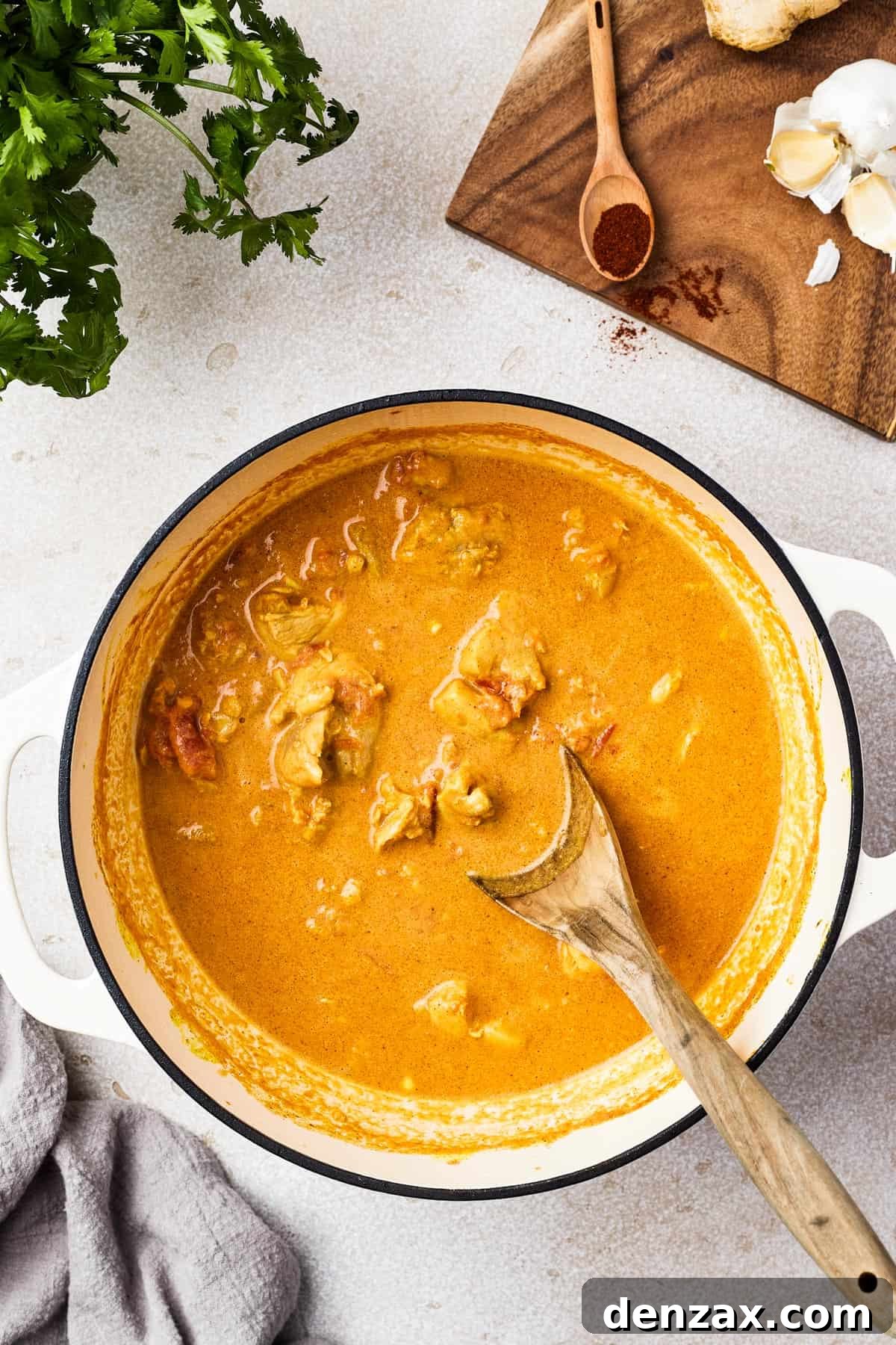 Butter Chicken Makhani 8 Rich and creamy butter chicken simmering in a large pot.
