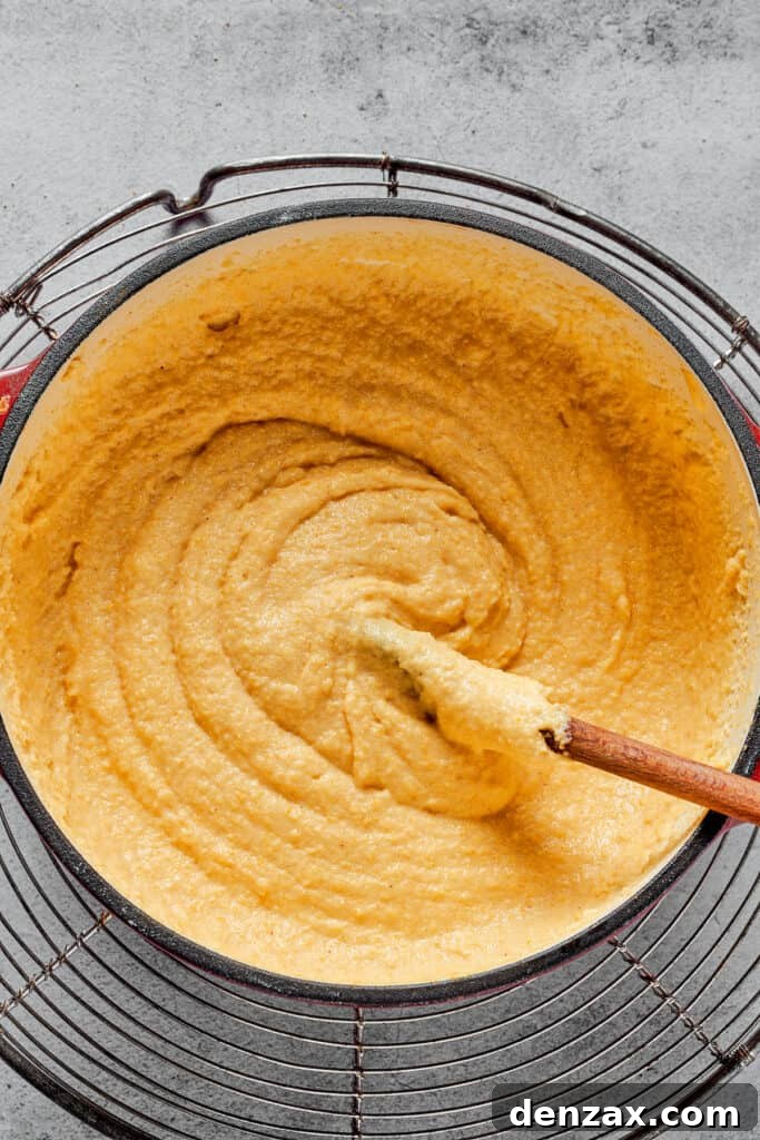 A Dutch oven filled with thick semolina batter.
