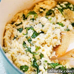 stirring rice and spinach with wooden spoon