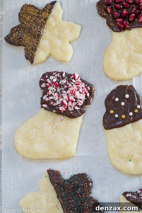 Decadent Chocolate Dipped Shortbread 8 Assortment of chocolate covered shortbread cookies with various festive toppings.