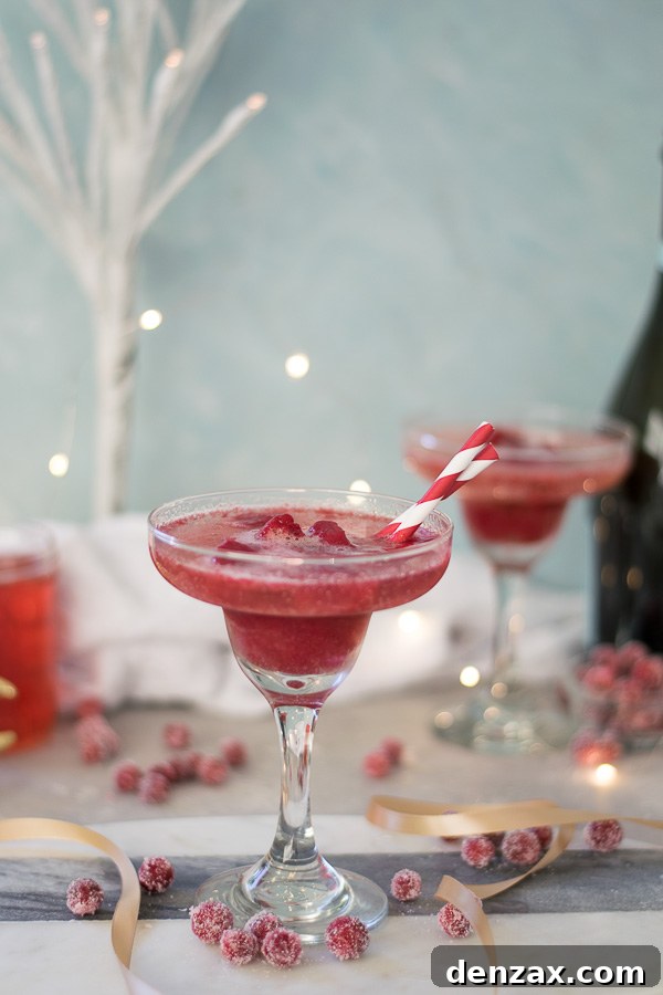 Close-up of a Cranberry Sorbet Champagne Float showing the sorbet melting into the champagne.