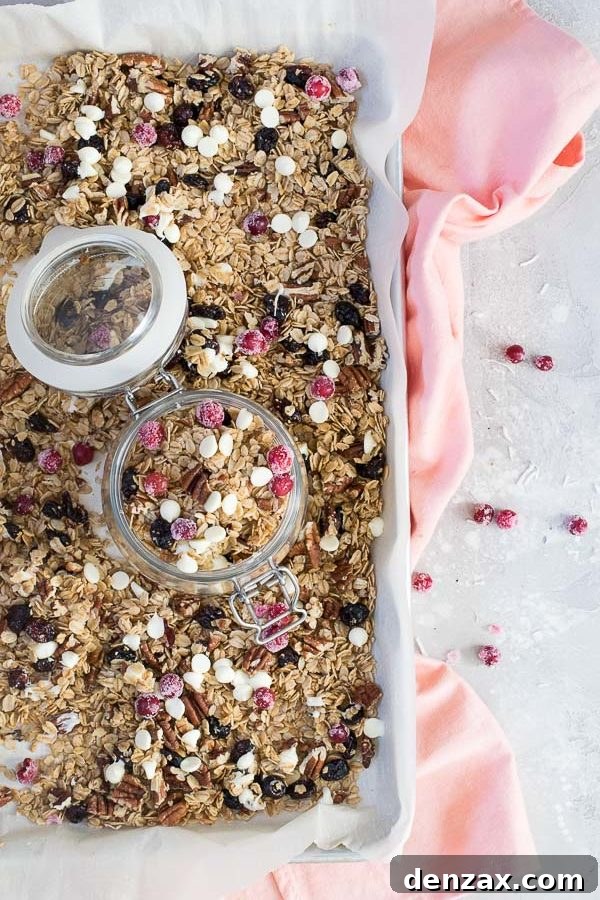 Cranberry pecan granola with white chocolate served in a bowl with yogurt