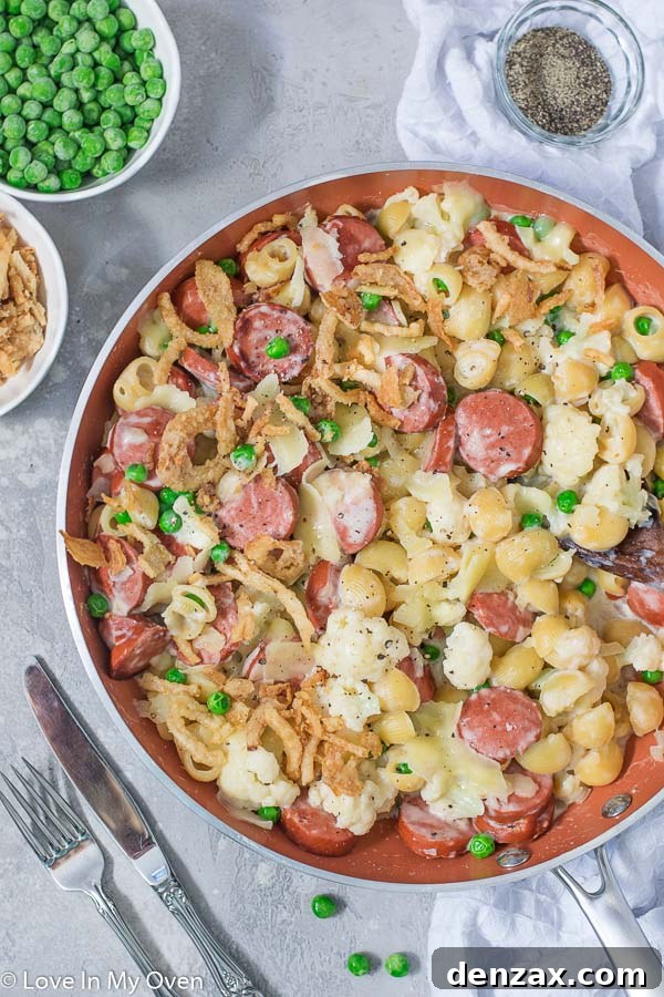 Delicious Veggie and Sausage Pasta Skillet ready to be served, showcasing pasta, sausage, cauliflower, and peas in a creamy sauce, perfect for a quick and easy dinner
