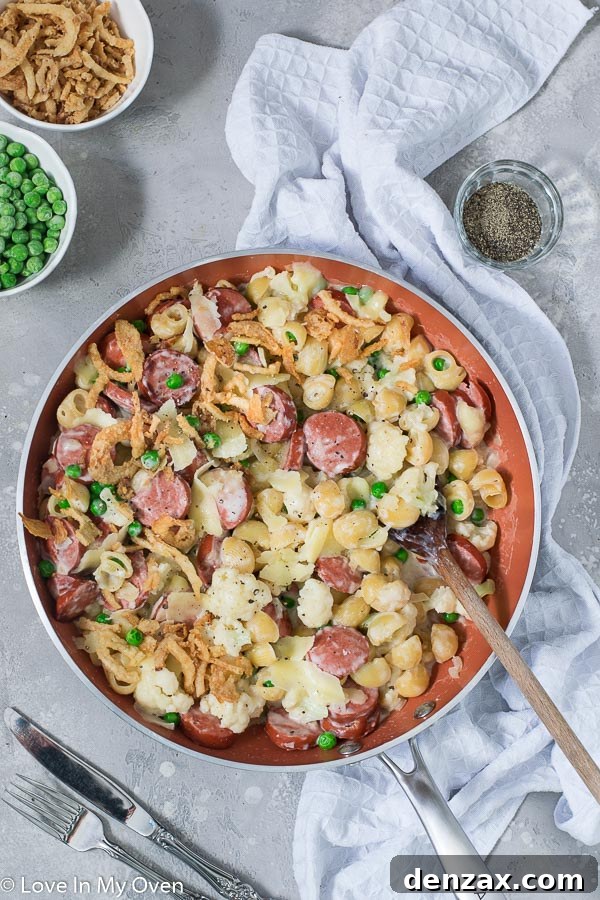 Close-up of the Veggie and Sausage Pasta Skillet in a pan, highlighting the creamy texture and evenly distributed ingredients, ready for a family dinner