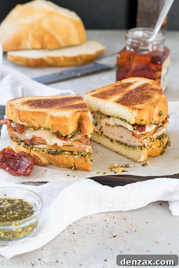 Close-up of a perfectly grilled turkey pesto sandwich