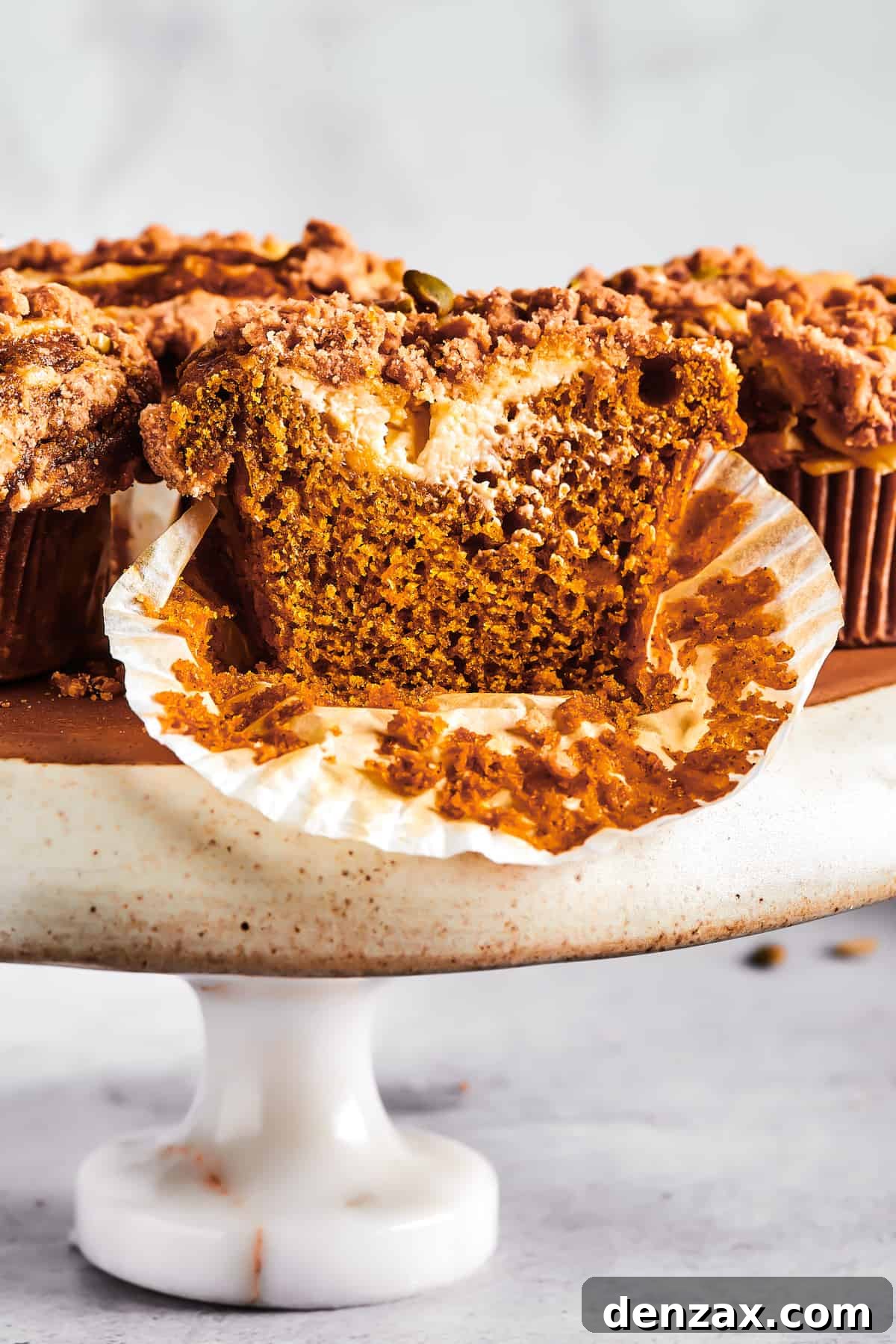 Pumpkin muffins arranged on a cake stand.
