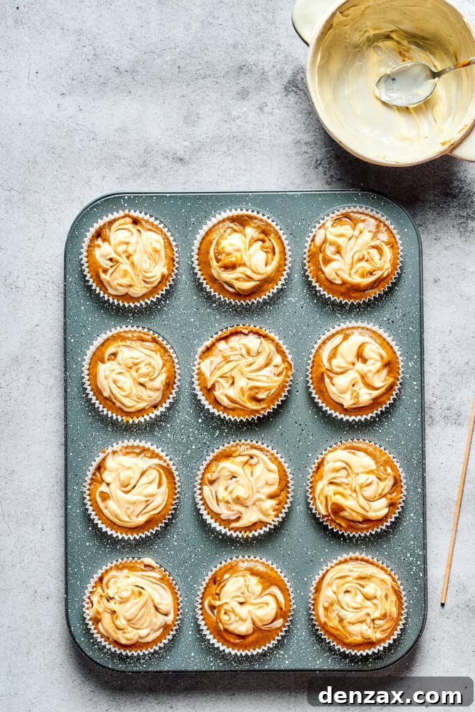Unbaked pumpkin cream cheese muffins.