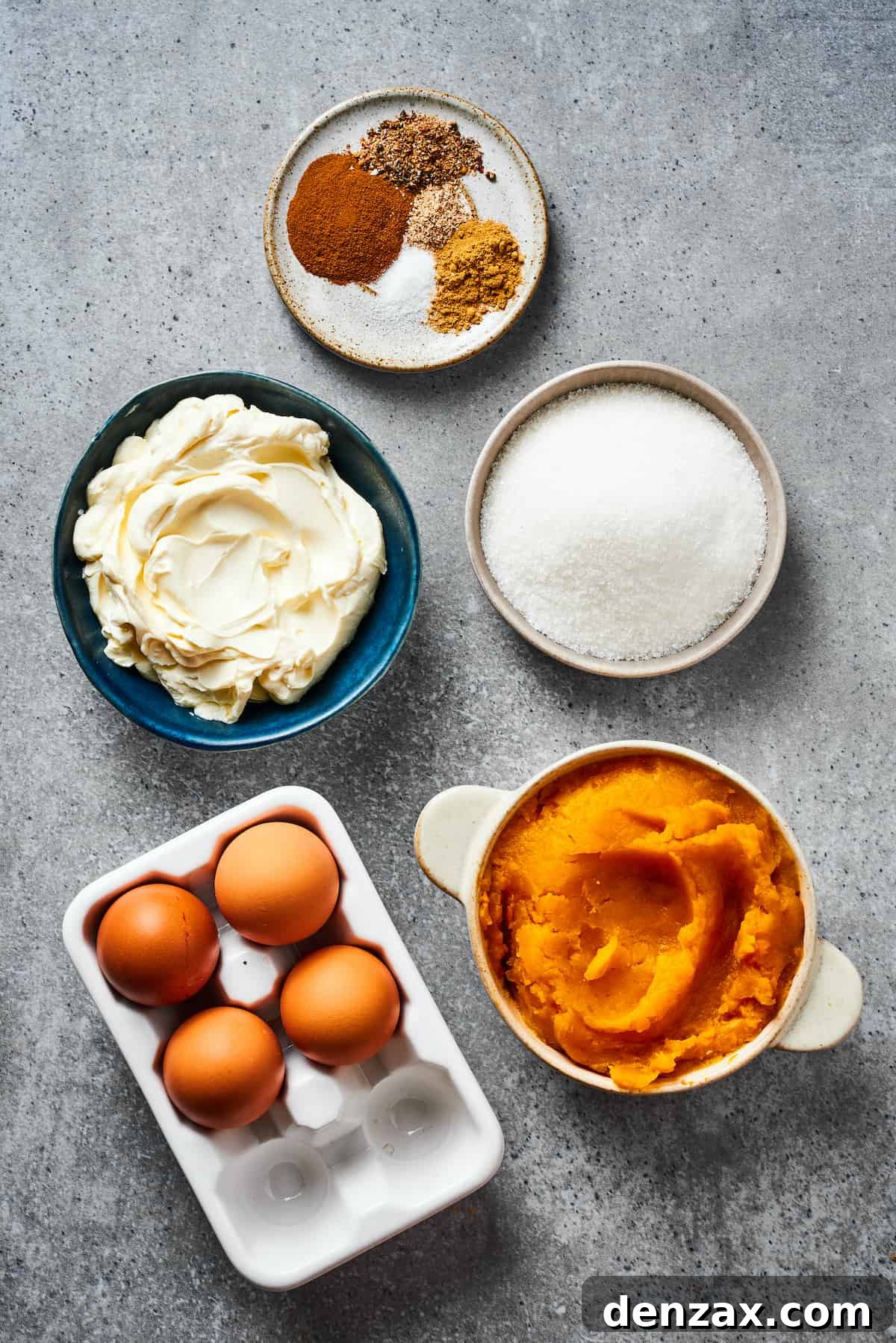 From top: Spices, sugar, pumpkin puree, eggs, and cream cheese, separated for the filling.