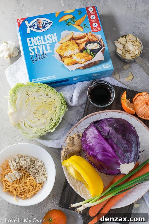 Close-up of fresh, colorful ingredients for Crunchy Ramen Noodle Salad, including cabbage, oranges, and green onions.