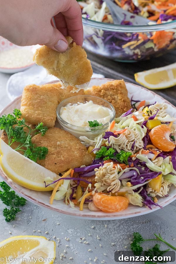 Close-up of a forkful of Crunchy Ramen Noodle Salad with mandarin oranges and noodles.