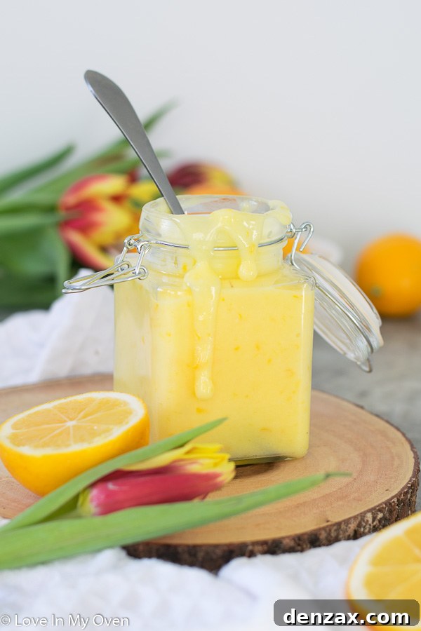 Smooth and vibrant Meyer lemon curd in a glass jar, ready to be enjoyed.