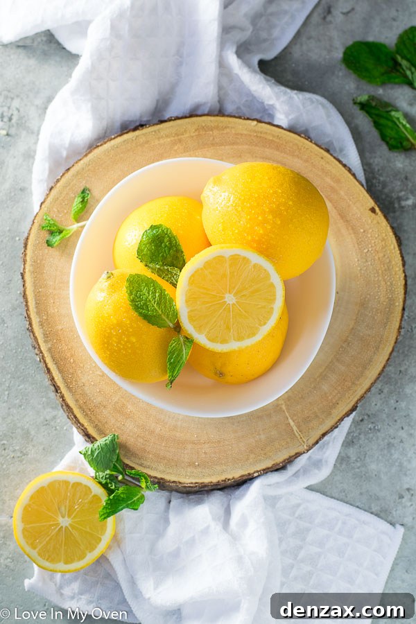 Fresh Meyer lemons arranged aesthetically, highlighting their unique color.