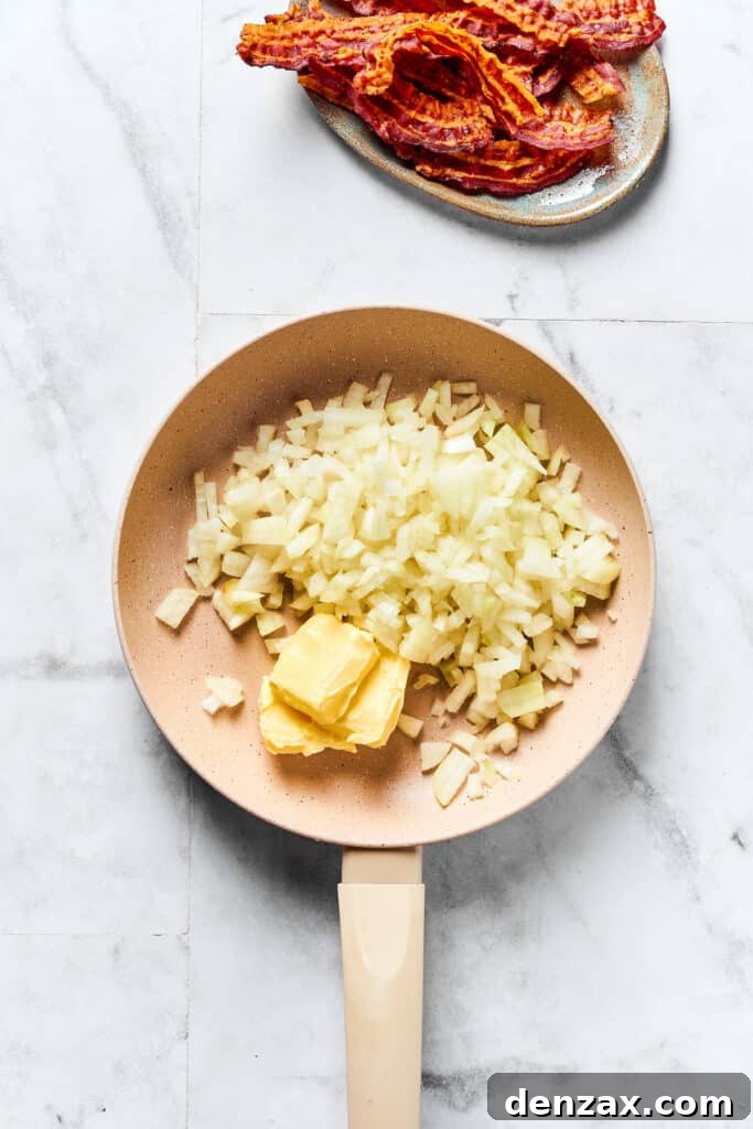 Chopped onions and butter sizzling in a skillet.
