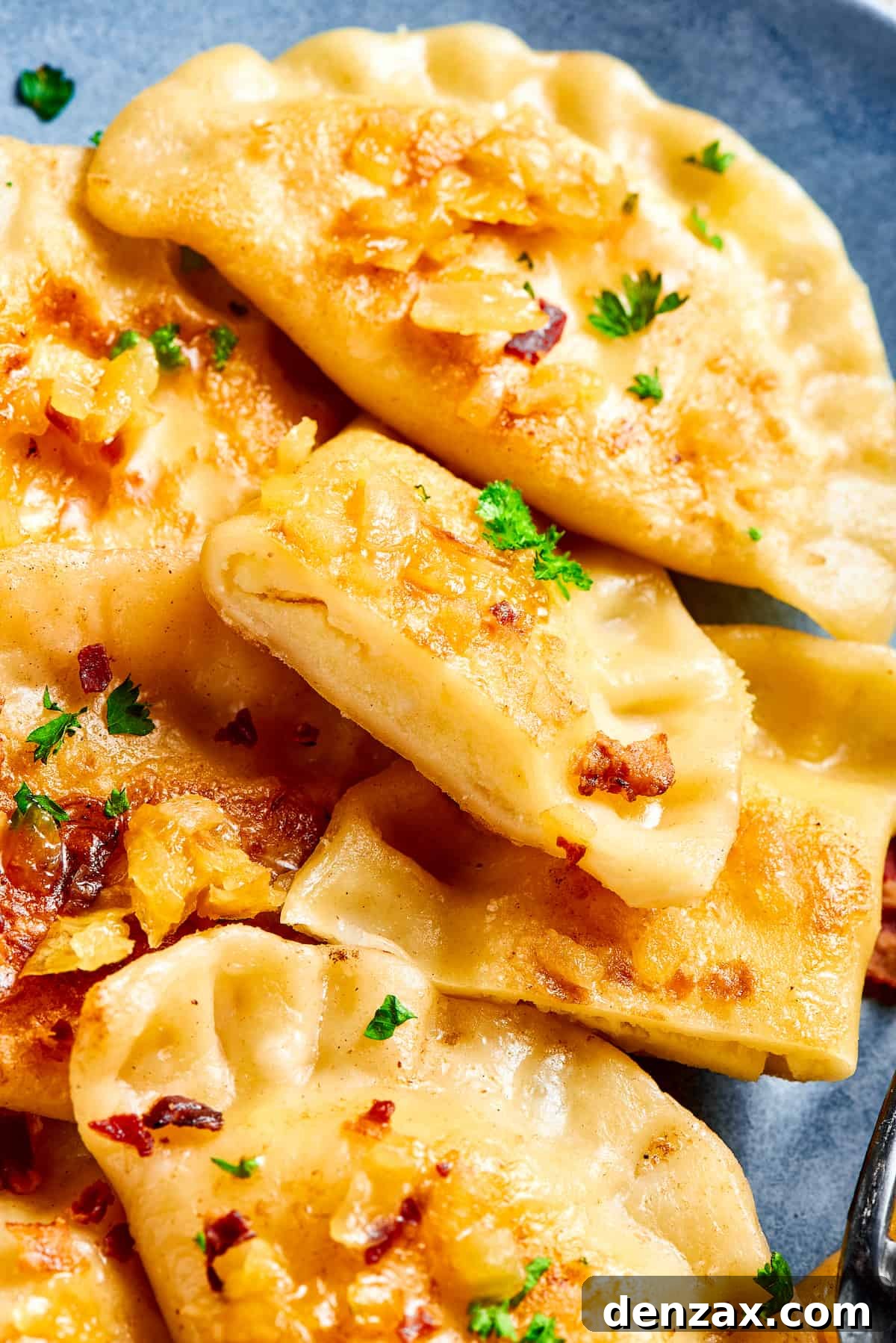 Traditional potato dumplings arranged beautifully on a plate, garnished with onions and bacon.
