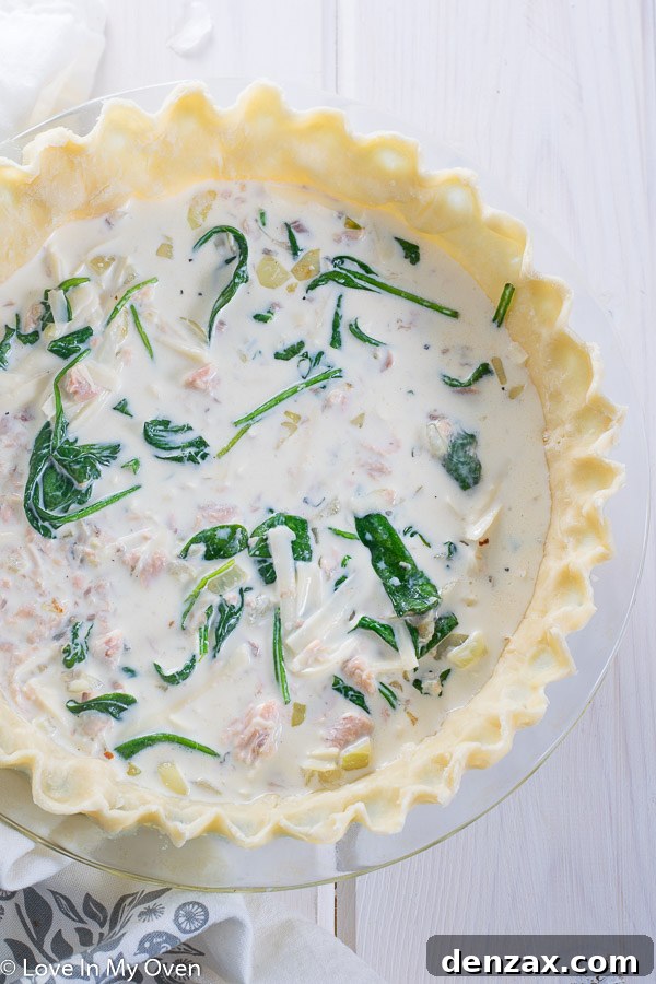 Mixing the salmon and spinach quiche filling.